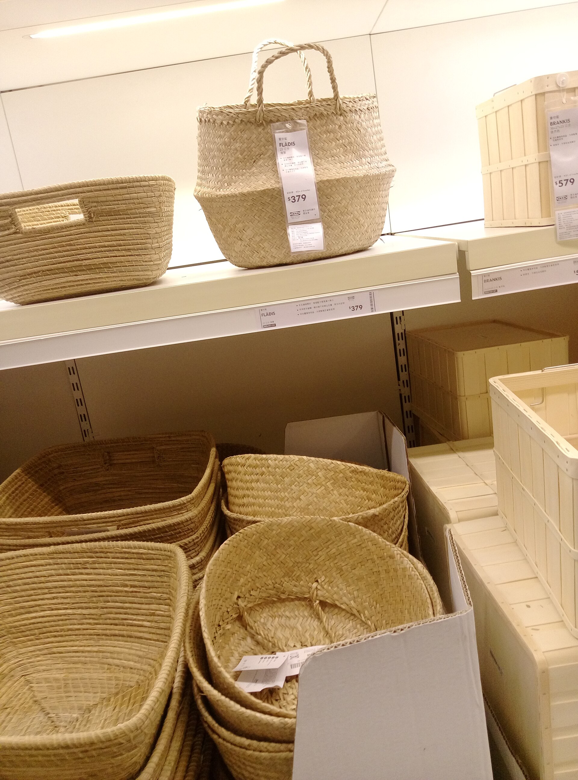 A wall of small woven baskets in mixed natural fibers